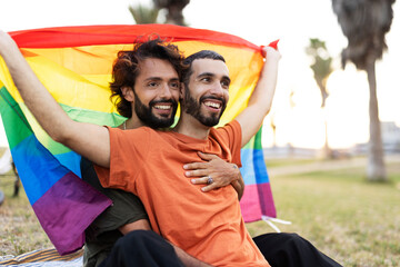  Happy couple with a pride flag. LGBT community