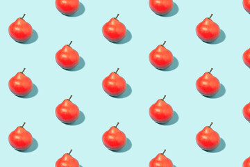 Red ripe pears on a mint background