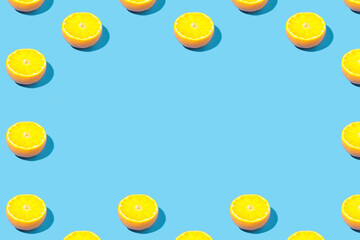 Ripe lemon slices on mint background - creative summer pattern