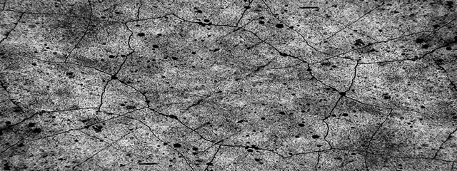 Abstract old stone wall texture, cracked and scratched grunge concrete or floor surface, old style black and white grunge texture, black and white background texture with distressed vintage grunge.