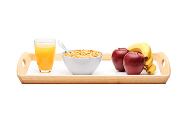 Wooden tray with apples, bananas, cereal and orange juice