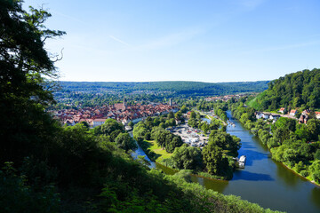 Fototapeta na wymiar View of Hann. Münden from the Weserliedanlage. Panorama landscape from the city with the confluence of the Werra and Fulda rivers into the Weser. 
