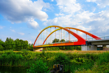 Bridge Dattelner Meerbogen near Datteln on the canal. Arched bridge in bright colors on the Dattelner Meer.
