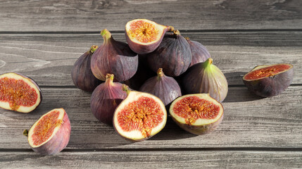 Juicy figs on a dark wooden background.