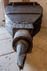 Large antique bellows on floor