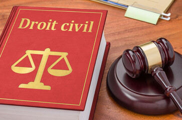 A law book with a gavel - Private law in french - Droit civil