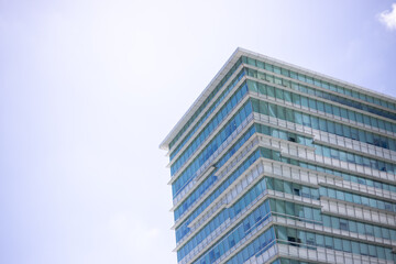 Fototapeta premium Urban abstract background, detail of modern glass facade, office business building at Taipei city, Taiwan