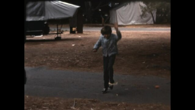 Skipping with Mom 1968 - A girl and her mother take turns playing with a skipping toy at El Capitan State Beach campground, in California, 1968.