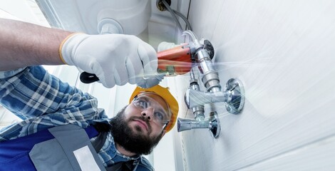 Technician plumber with a wrench, concept of repair, fix water plumbing leaks