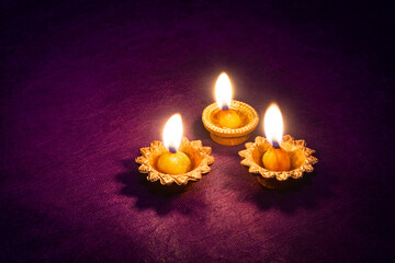 Clay diya lamps lit during diwali celebration. Indian festival diwali