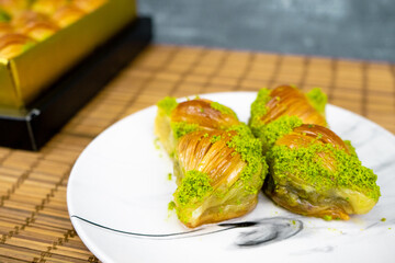 Close-up view of mussel baklava with pistachio and walnuts