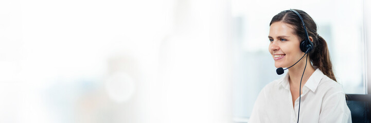 Beautiful female call center service support concept in headset Female customer support or sales representative. Telephone service providers support customers in headsets, call centers. banner image