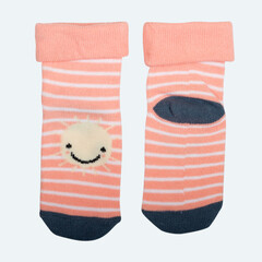 striped pink socks with sun for baby isolated on white, front and back view