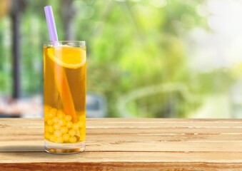 Iced drink tea, fruit tea with juice and sugar in glass
