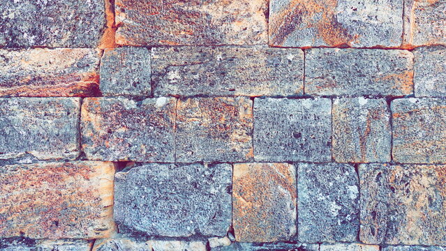 Stone Wall. Graphic Brickwork Construction. Brick Pattern Background. Toned Photo with Filter