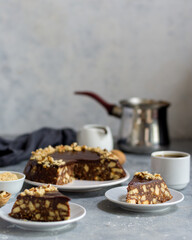Chocolate biscuit cake, background and foreground out of focus, main subject is a slice of cake on a plate in focus.
