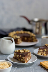 A piece of chocolate cookie cake, the background of the cake is out of focus.