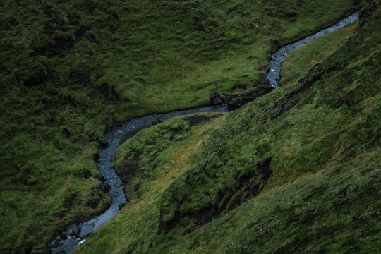 Winding river flowing through a lush green valley in Iceland – Landscape Photography