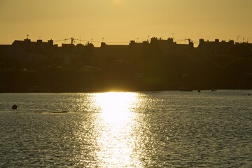 Naklejka premium sunset over the river