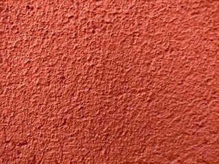 Fototapeta premium The red cement wall ,has a rough surface. For texture background images