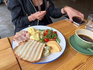 girl eating breakfast in a cafe