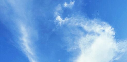 Beautiful clear light blue sky with white clouds in sunny day. You can use for Mobile Applications, Desktop background, Texture, Wallpaper and the other site.