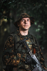 Portrait of an eastern special forces soldier with rifle