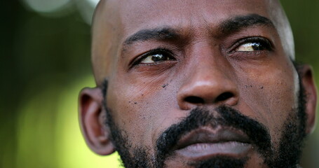 Obraz premium Pensive African man close-up face. Thoughtful black person