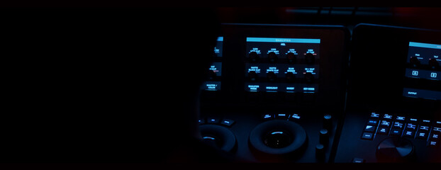 Edit video production control panel in studio. Editor editing and grade film in movie post room. Telecine control machine and man hand editing or adjusting color on digital video in post production.