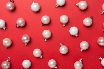 Christmas balls on color background, top view