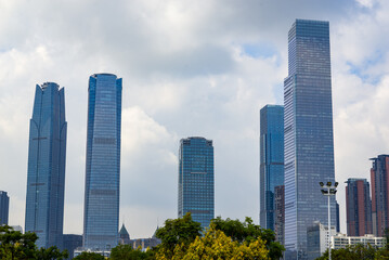 Obraz premium High-rise building with glass curtain wall in city business district