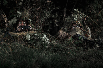 Eastern special forces soldier with rifle in woodland