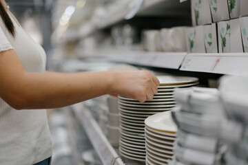 woman buying cutlery in mall