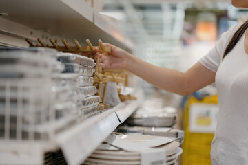 woman buying cutlery in mall