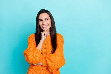 Portrait of adorable creative minded person arm touch chin beaming smile look empty space isolated...