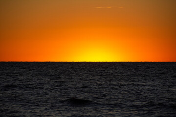 Light on the horizon over the sea after sunset