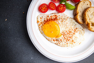 breakfast fried egg, tomato, healthy meal food snack on the table copy space food background 
