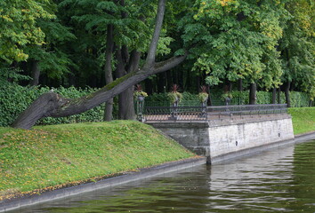 Fototapeta na wymiar The shore of the Summer Garden from the side of the Swan Groove, Summer Garden, St. Petersburg, Russia, September 2022