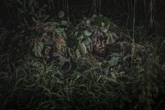 VDV special forces soldiers with rifles in woodland