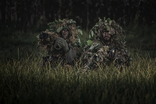 VDV special forces soldiers with rifles in woodland