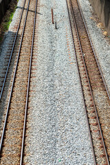 Fototapeta na wymiar Railroad tracks in the city of Belo Horizonte. Stone pavement. 