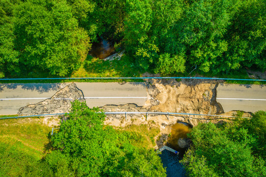 The road and bridge washed out and destroyed after the heavy rain and flood