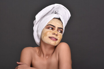 A young woman's face with home made face mask applied for skin care 