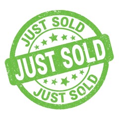 JUST SOLD text written on green round stamp sign.