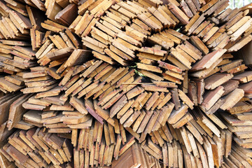 irregularly stacked timber abstract background, Old wooden boards preparing for the construction of the house, Pattern on the edge of several pieces of wood