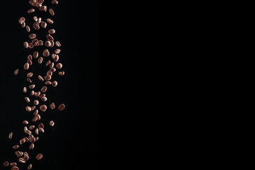 Coffee beans in flight on a dark background