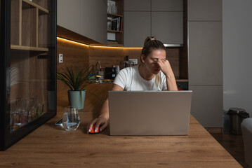 Exhausted woman suffering from severe headache massaging eyes having tension or strain, tired overworked female experience blurry vision of dizziness after long working at laptop. Fatigue concept