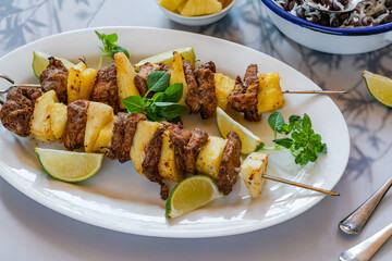 Jerk pork and pineapple skewers with black bean rice