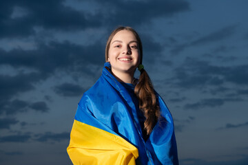 cheerful ukrainian teen girl. teen child with flag. teen kid with flag of ukraine