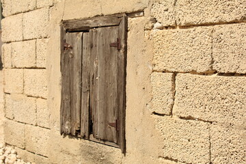 an old wooden window on a brick house